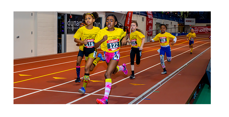 Five elementary age girls running a race during Colgate Womens Games 