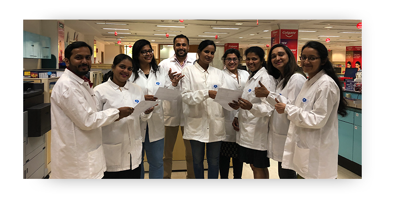 Indian Global Technology Centre team of scientists wearing lab coats standing together