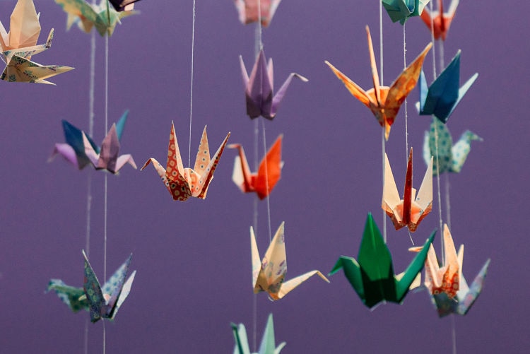 Image of paper cranes hanging off a ceiling in the Northeast Cancer Centre.