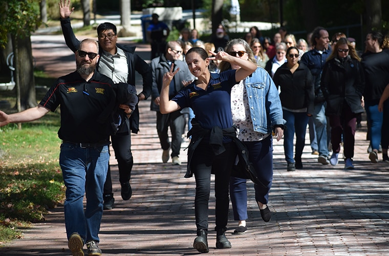 University of Guelph faculty and staff walking on campus.