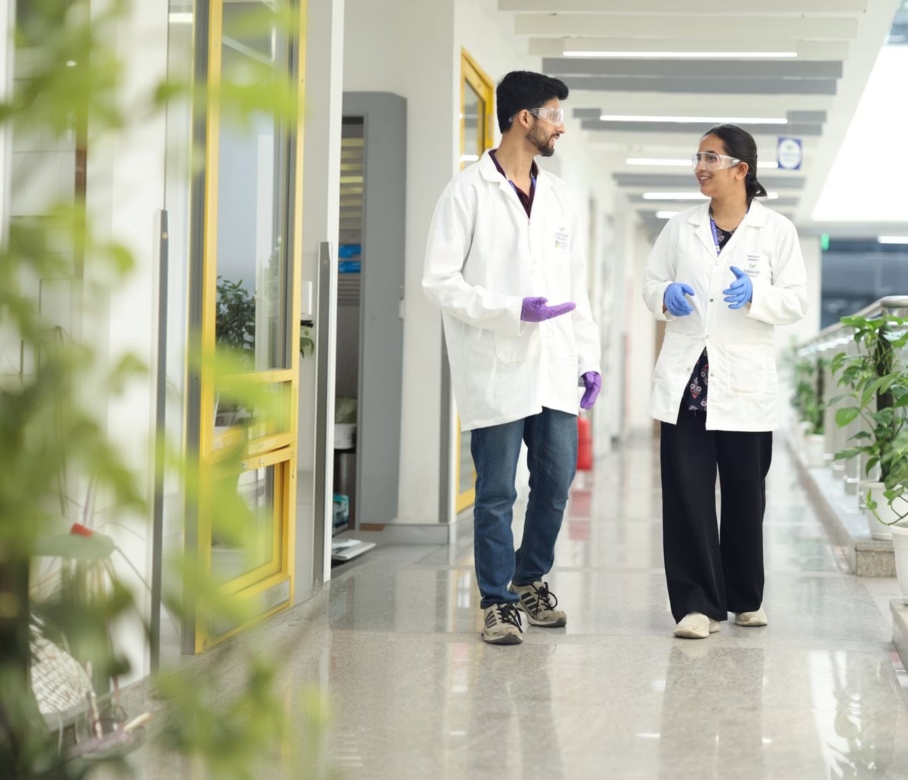 Jubilant Pharmova colleagues in corridor