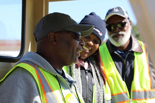 Group of METRO employees smiling and interacting with each other