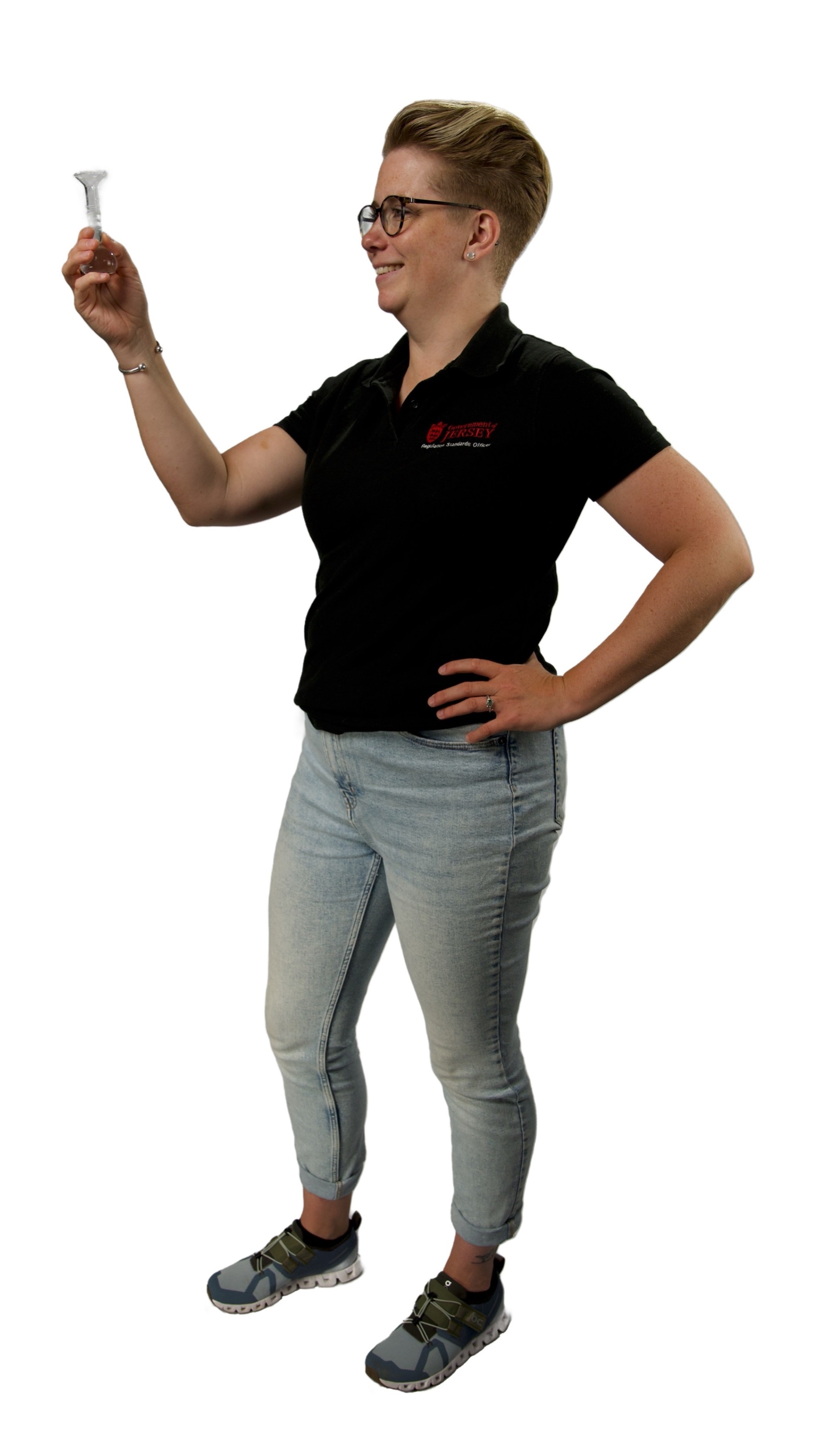 A person wearing casual clothes, holding up a small object, representing internships.