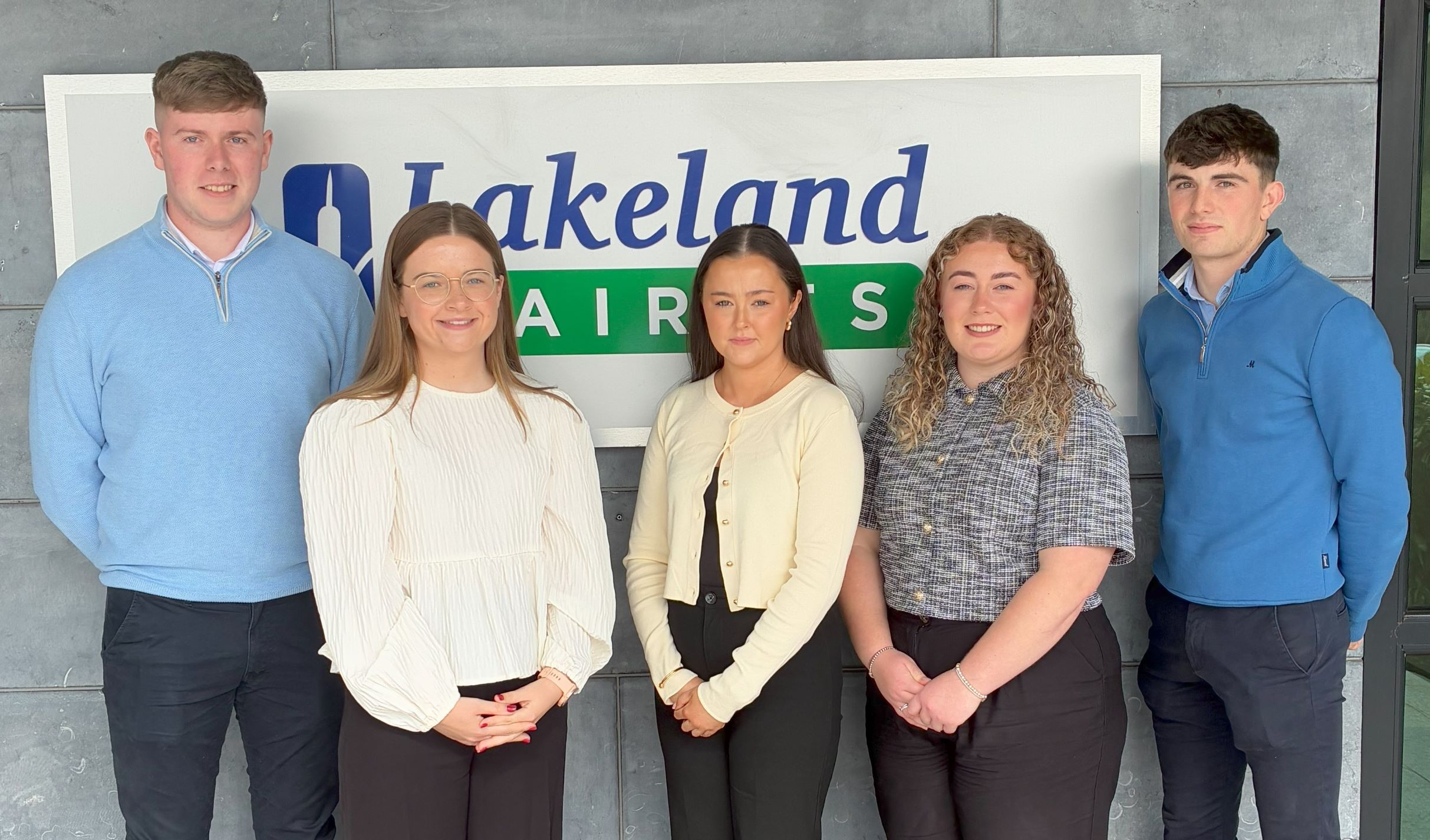 A group of five graduates