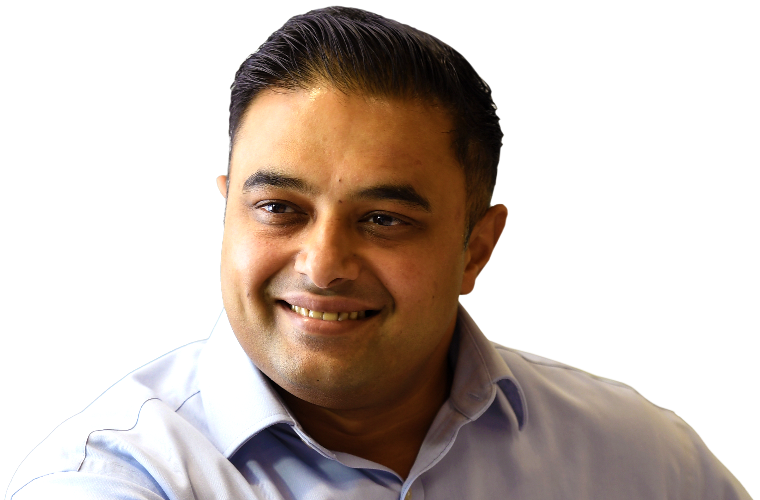 A colleague smiling in a meeting.