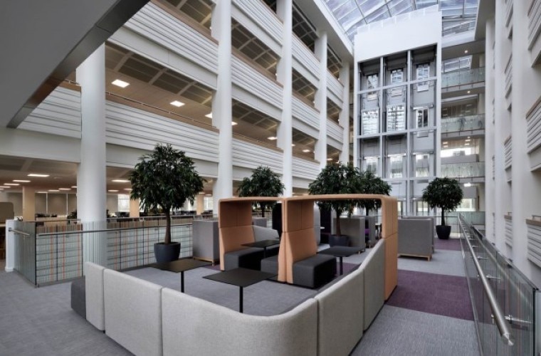 An open atrium with seating and trees.