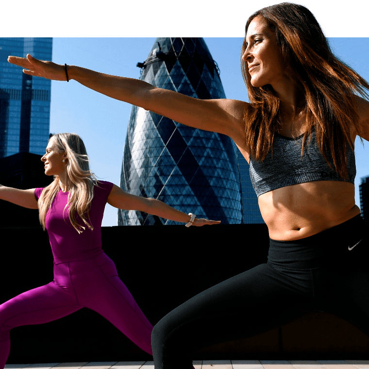 Two colleagues doing yoga.