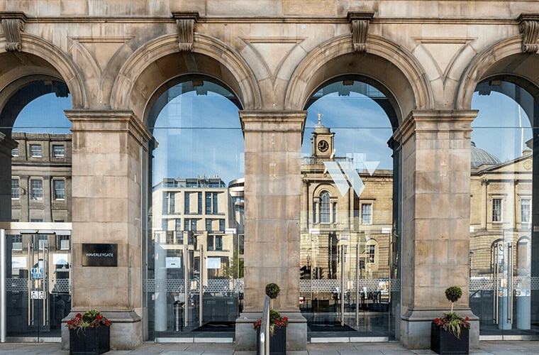 A Victorian stone façade with arches from floor to ceiling now glass windows.
