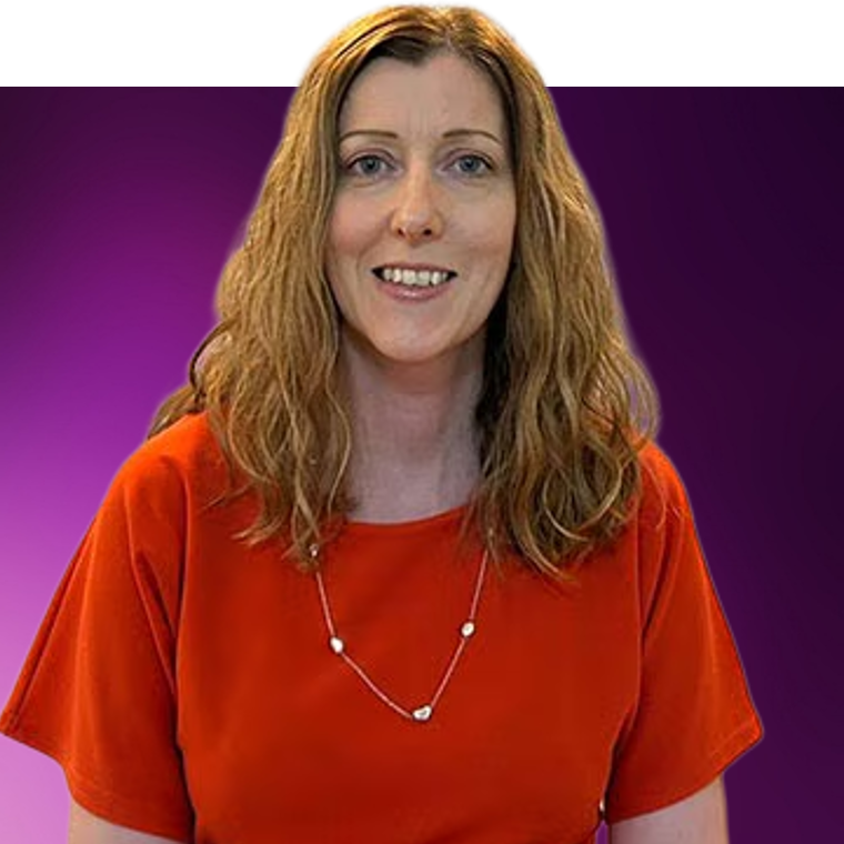 A colleague with light coloured hair wearing a red coloured shirt under a gold necklace.