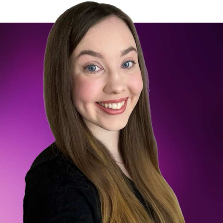 A colleague with brown hair wearing a black coloured top, they are smiling.