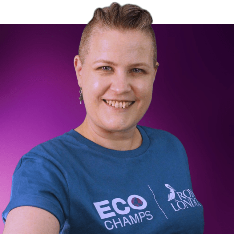 A colleague smiling, wearing a teal coloured t-shirt with the Royal London logo and the word eco champs on the front.
