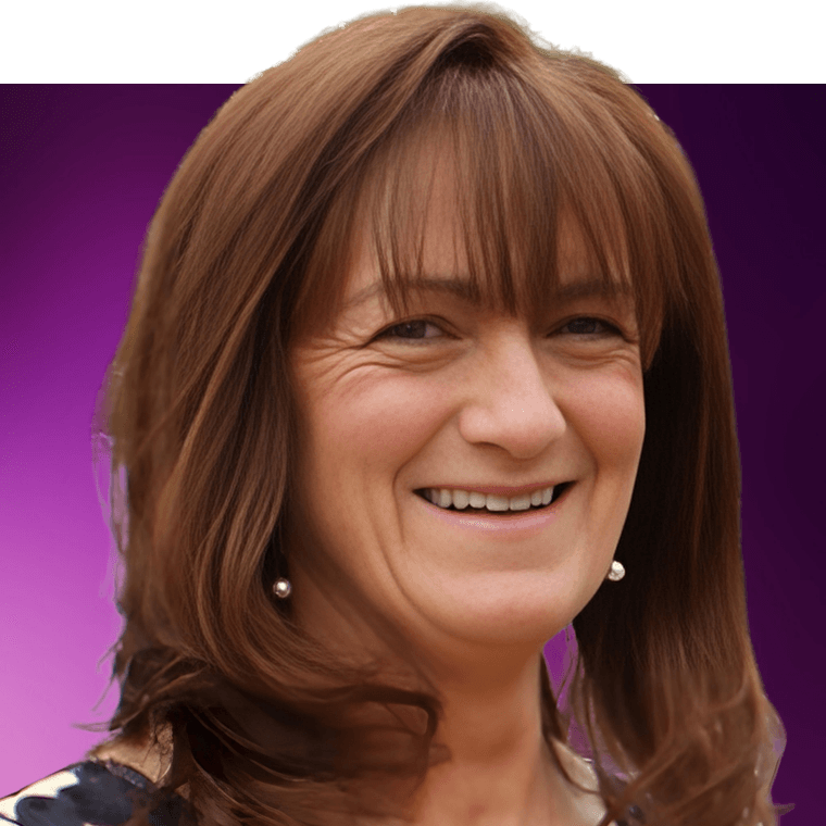 A colleague with long brown hair wearing pearl earrings smiling at the camera.