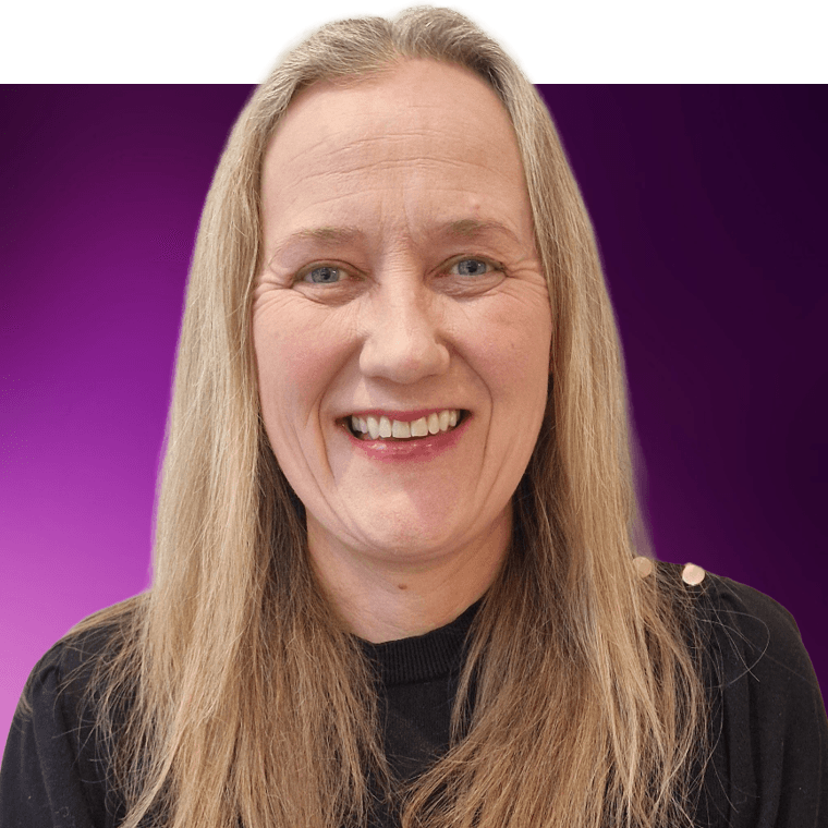 A colleague with long light coloured hair wearing a black top, smiling.