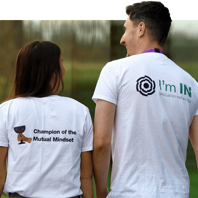 Colleagues wearing t-shirts promoting inclusion.