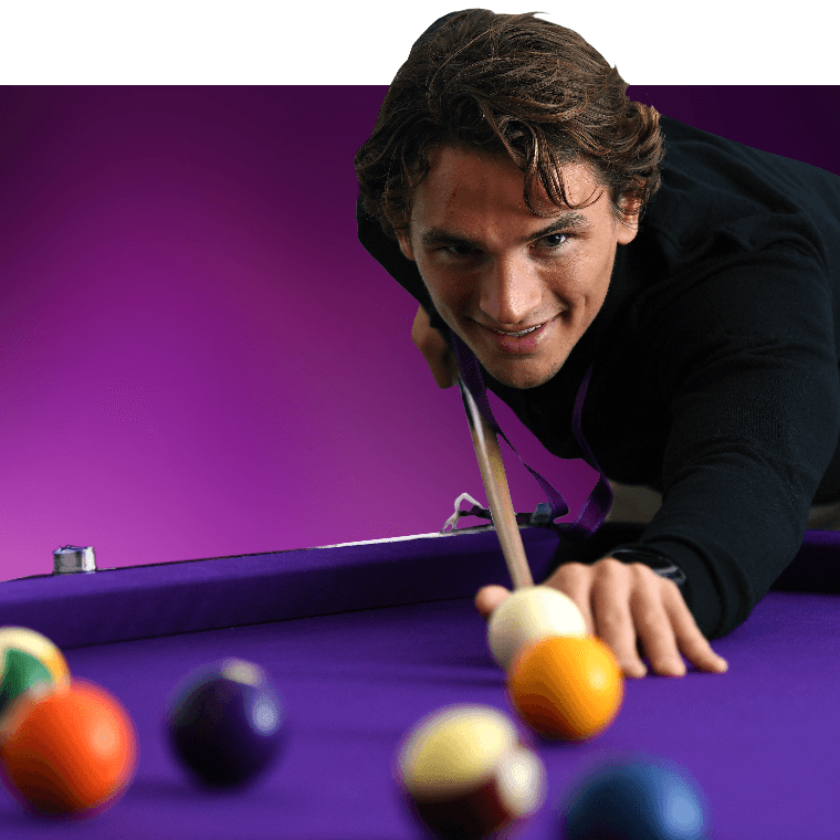 A colleague playing a game of pool.