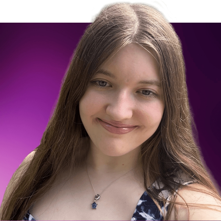 A colleague with brown hair wearing a small turtle necklace.