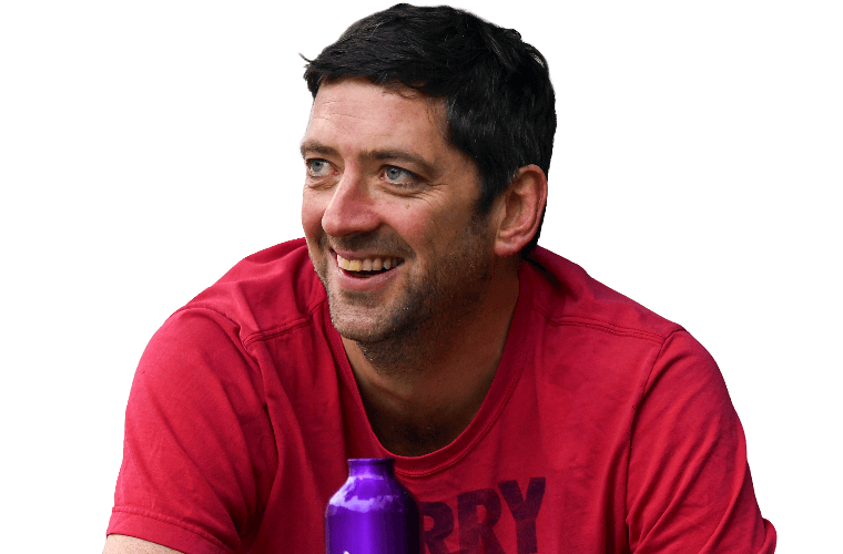 A colleague resting with a drink on a bicycle.