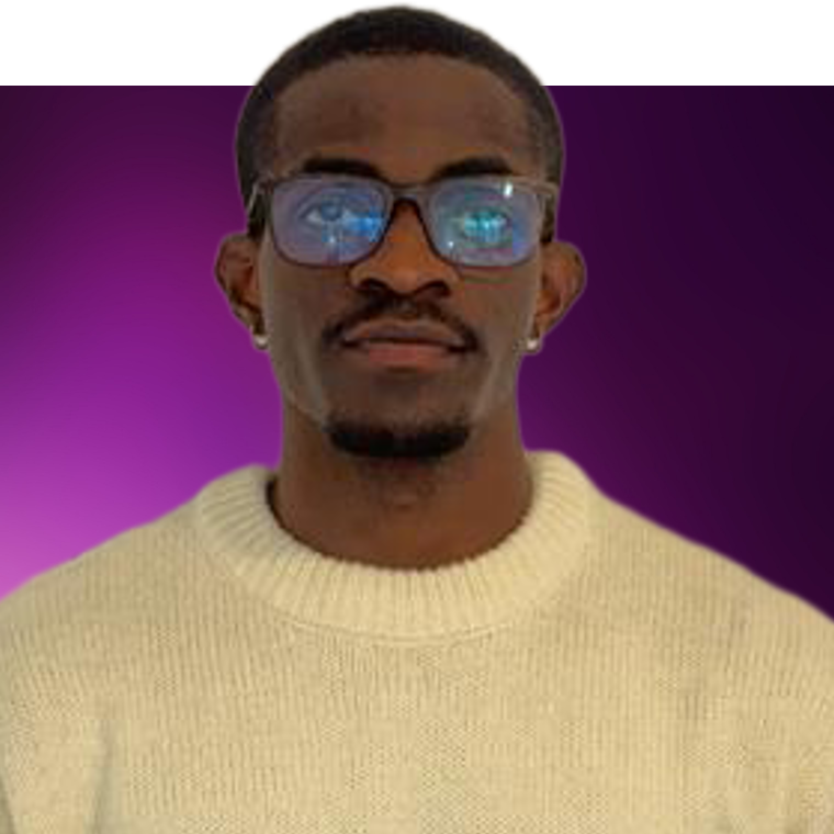 A colleague wearing glasses and a cream coloured jumper.