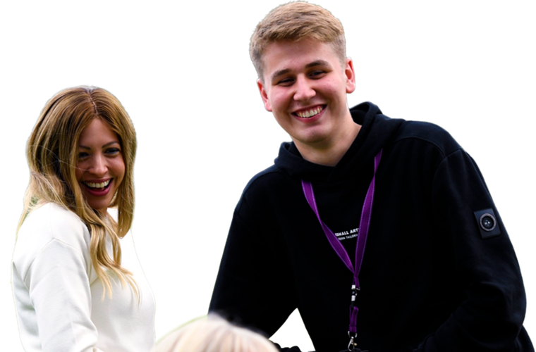 Colleagues talking and smiling outdoors.