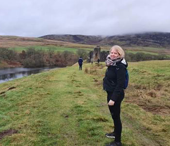 woman poses in foggy outdoors