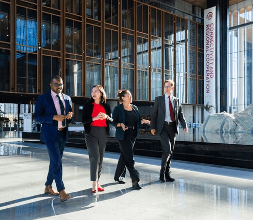 AIIB colleagues walking through an office