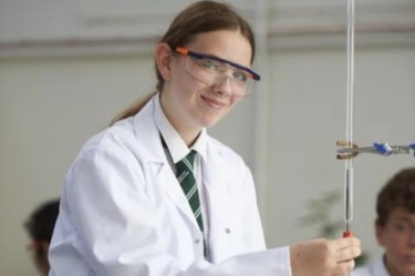 Girl doing science in school