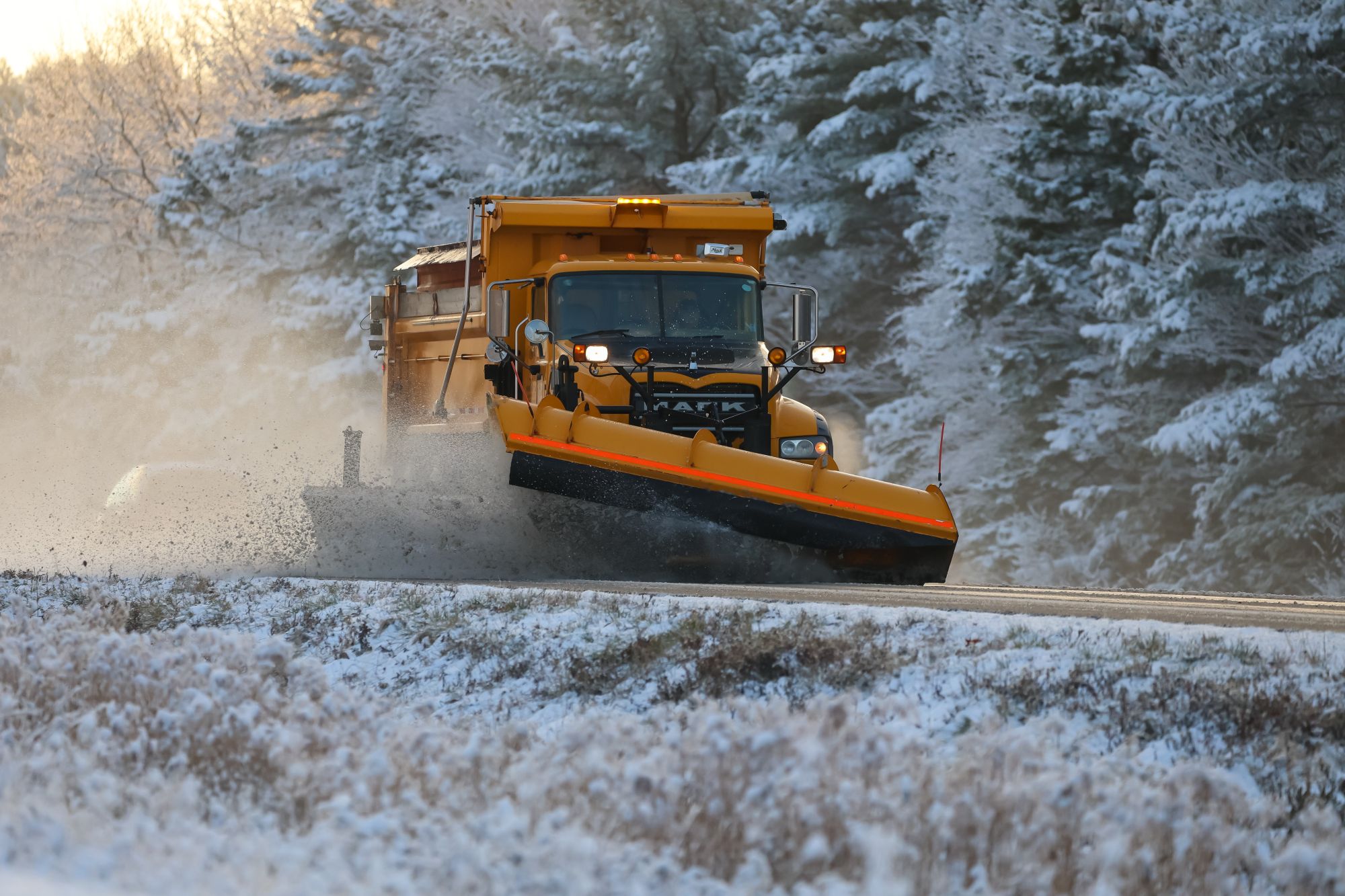 Snowplow clearing a winter road