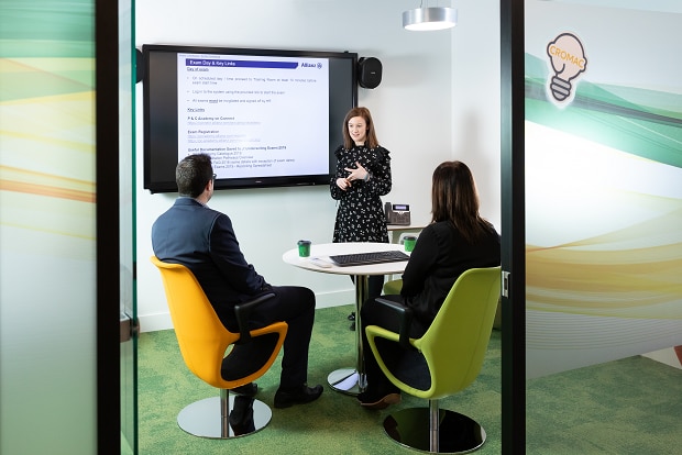 An Allianz employee presenting to colleagues