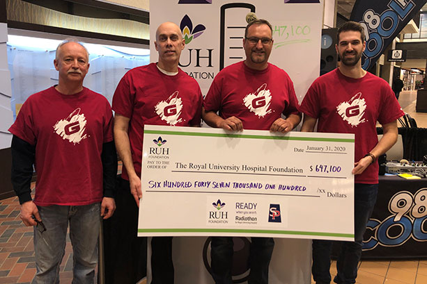 Graham employees presenting a cheque to a charitable organization.