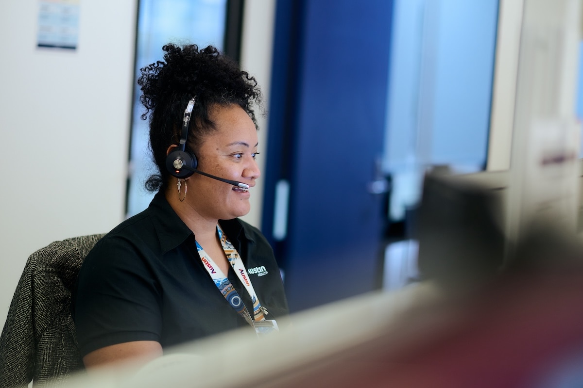 A call centre worker taking a call wearing a headset