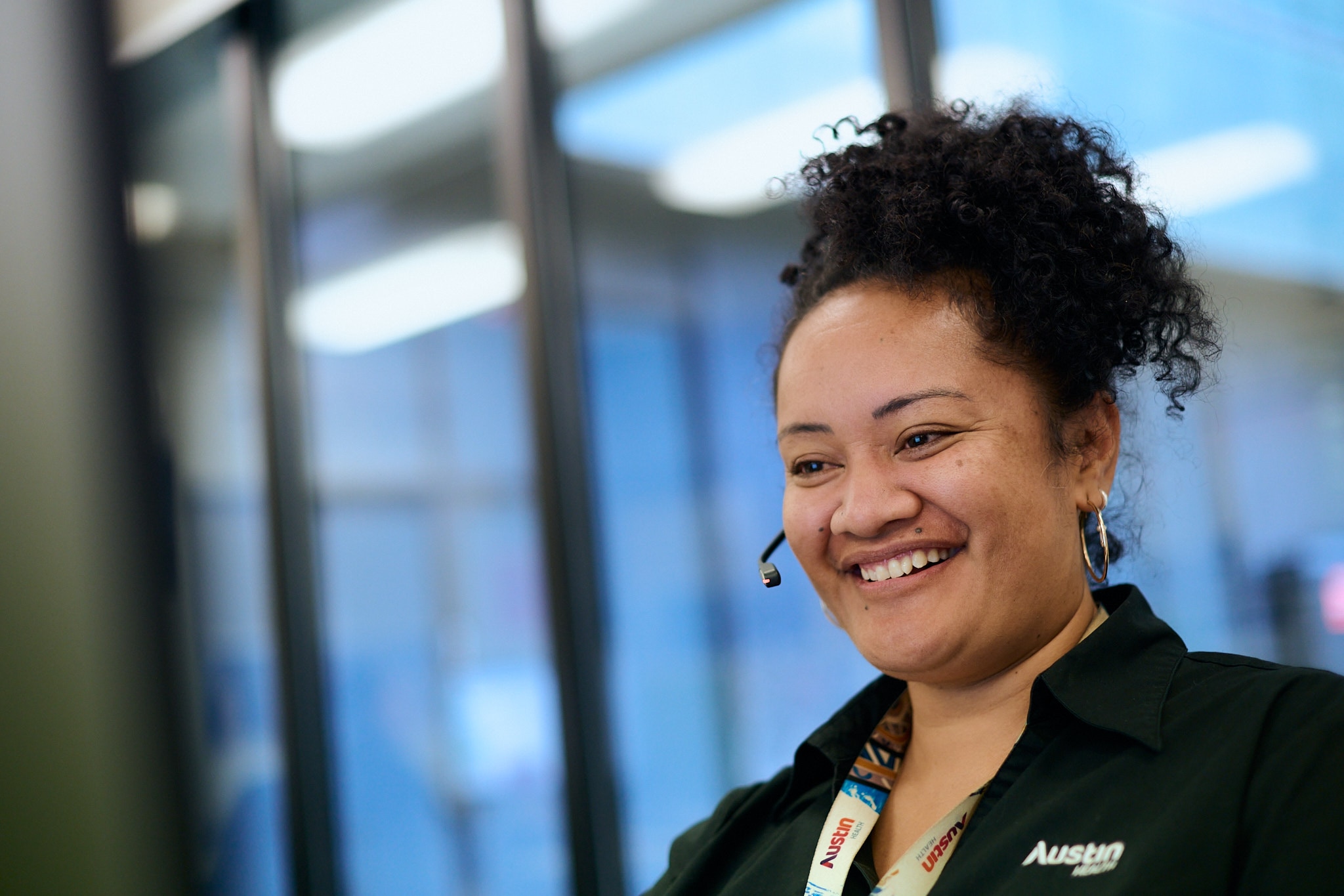A call centre worker taking a call wearing a headset